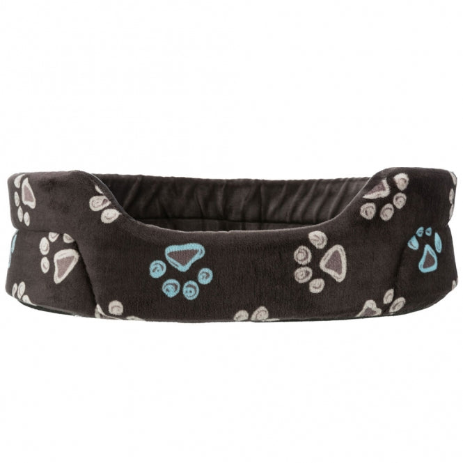 Braunes Hundekörbchen mig beigen und hellblauen Pfoten als Muster